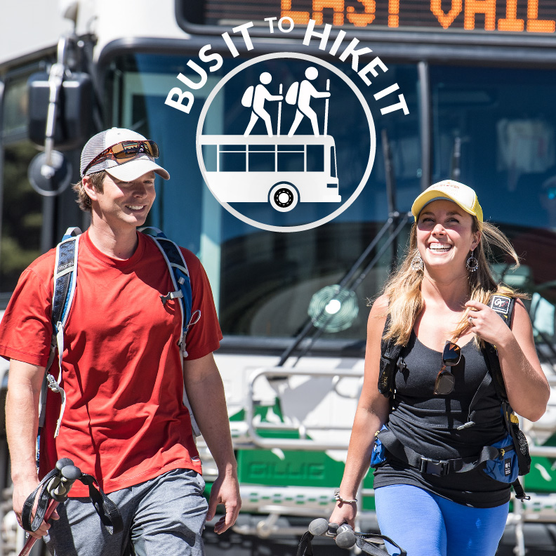 Logo for Hike Vail with two hikers walking from East Vail bus